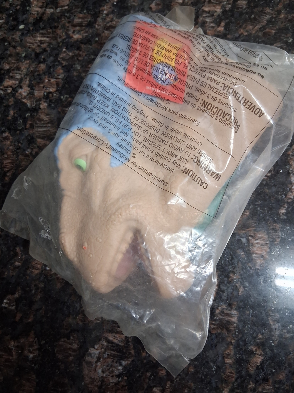 Beige Dinosaur Head Toy with Green Eye